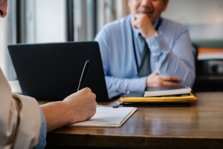 Illustration of Work-From-Home Scams — a resume open on a laptop